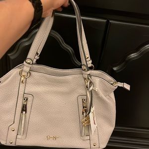 Sand colored handbag by Jessica Simpson